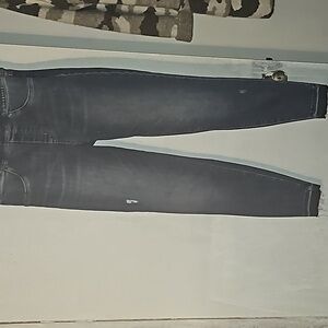 A pair of spanx skinny leg jeans